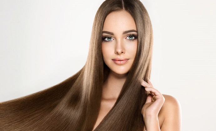 young attractive girl-model with gorgeous, shiny, long, straight hair. good and healthy hair as resalt of right care.