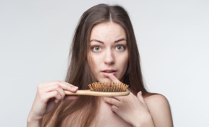 one young beautiful woman waves through hair loss